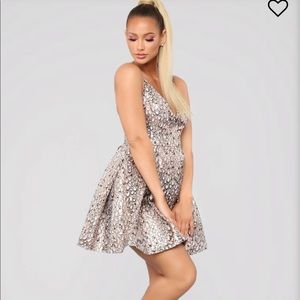 Catch his eye flare dress by Fashion Nova